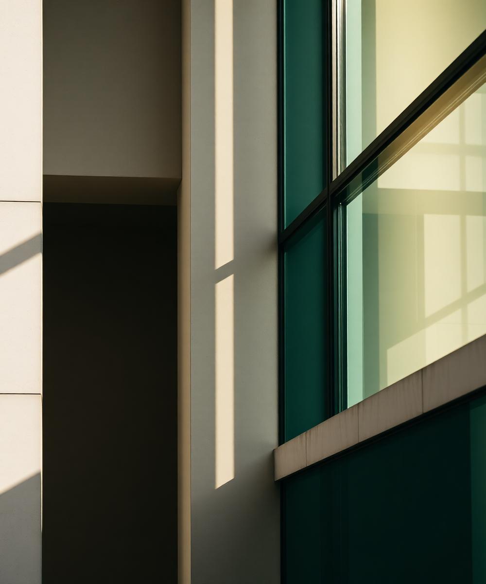 Architectural detail — concrete meeting glass